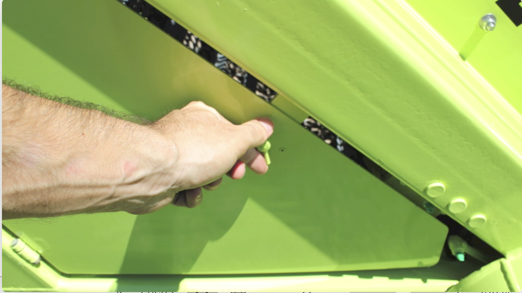 #1 Open the side door, turning the latch counterclockwise to reveal the Conveyor.