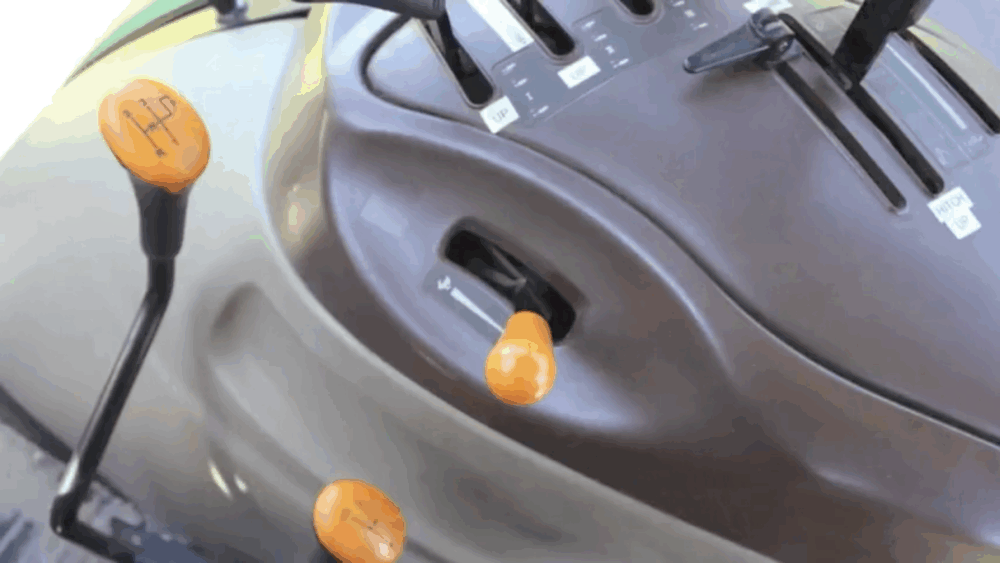 Instead of using the throttle, use the gears to control the tractor’s ground speed.