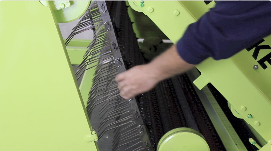 #2 Check Conveyor tension by pulling the chain back and forth.
