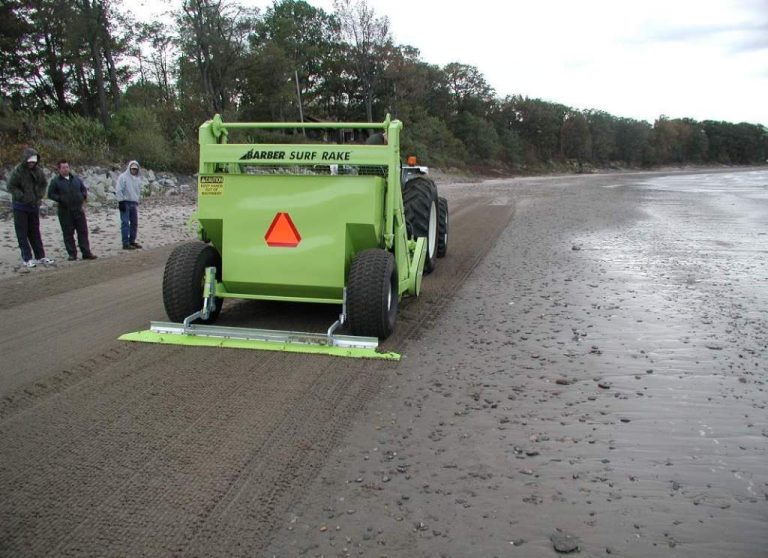 the SURF RAKE: beach cleaning machine removes deris from wet beaches without clogging or picking up sand