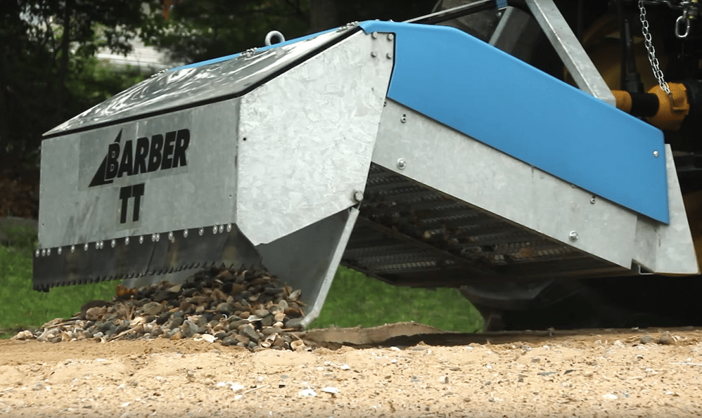 sand sifting machine dumping rocks from hopper