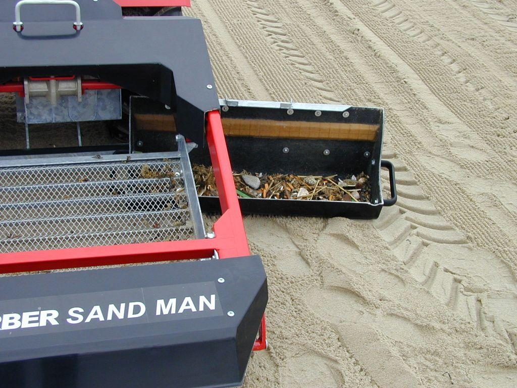 After removing materials from the sand/soil, the SAND MAN's bucket is easily removed to dispose of the debris.