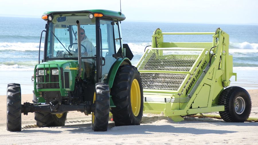 used beach cleaner being used by a contractor