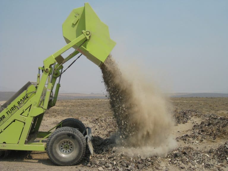 turf rake dumping stones