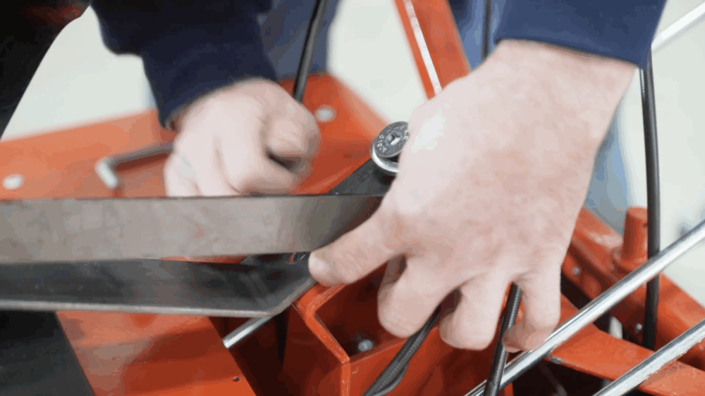 #3 Remove the metal arm by unscrewing the two screws that hold it to the main frame.