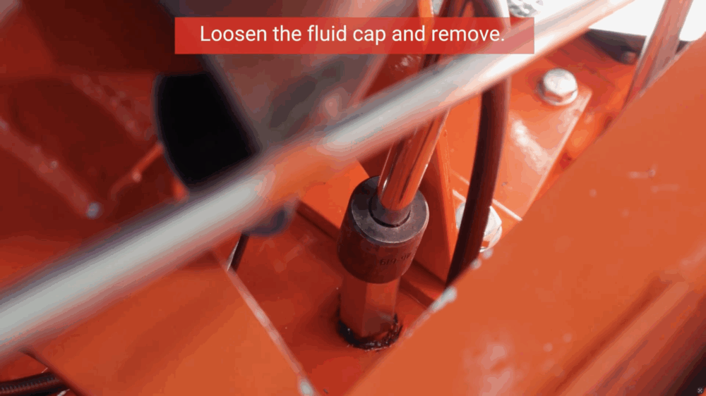 #4 Loosen the fluid cap and remove.