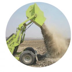 turf rake dumps stones into pile