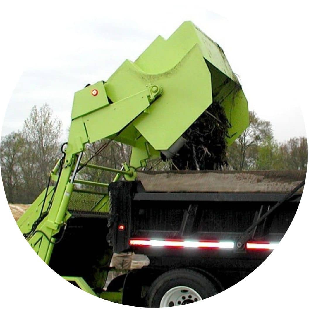 road rake dumps debris into truck